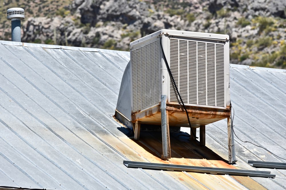 Rooftop evaporative swamp cooler on an Aurora home — prime candidate for central AC conversion